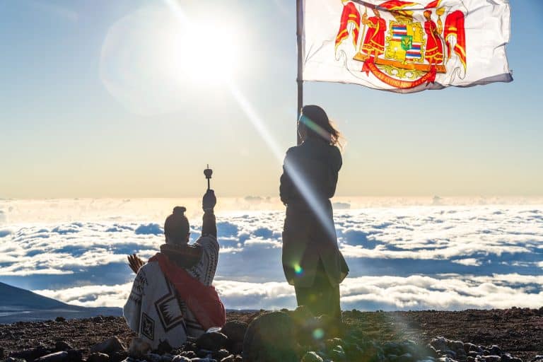 indigenous hawaiian ceremony taking place on a beach